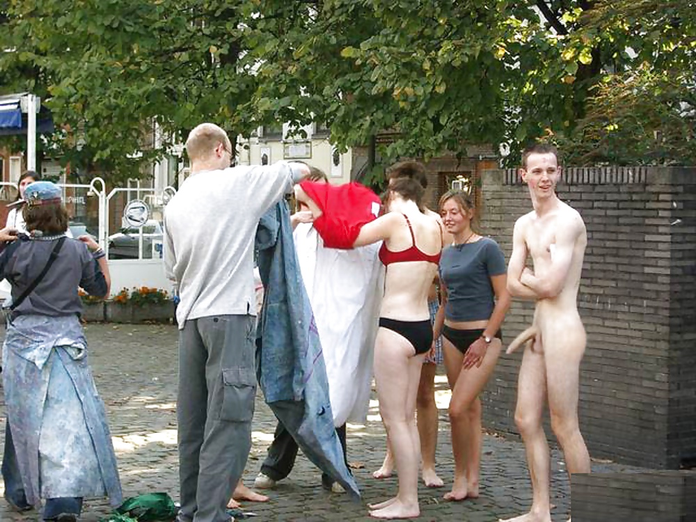 Nude male with girls on street