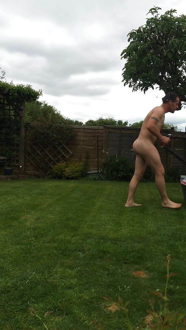 More related nude men mowing the lawn.