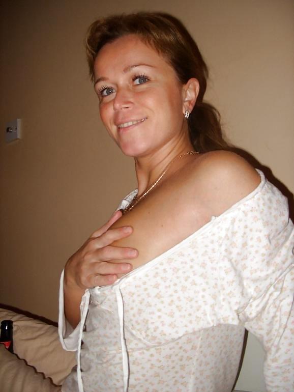 Mature Amateur Poses With Her Budweiser porn pictures