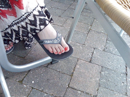 Linn 's Candid Feet - Female feet with red painted nails