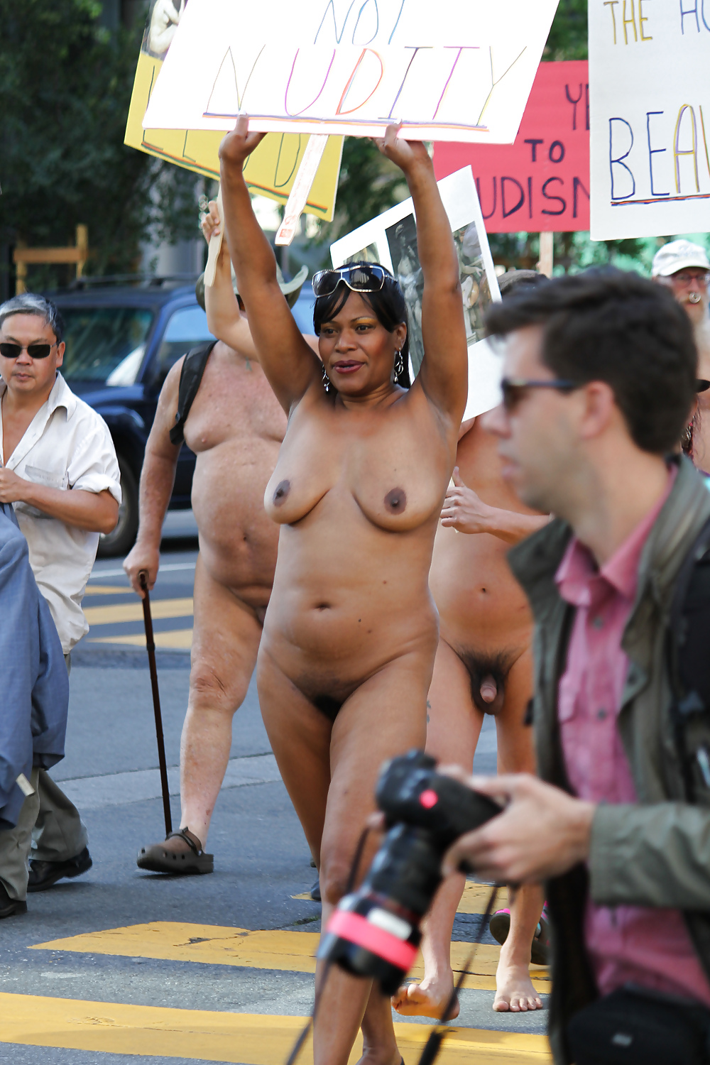 Black woman protesting naked in public. 