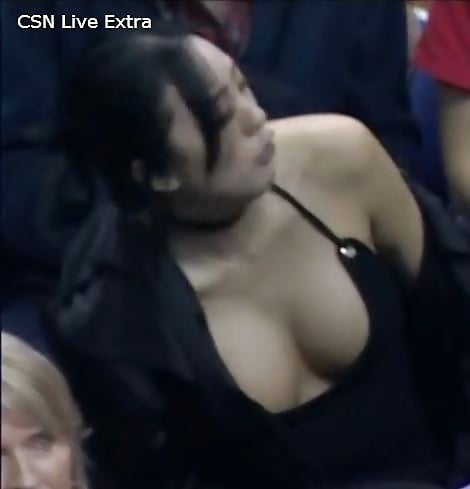 Dirty Asian slut showing massive cleavage at NBA game porn pictures
