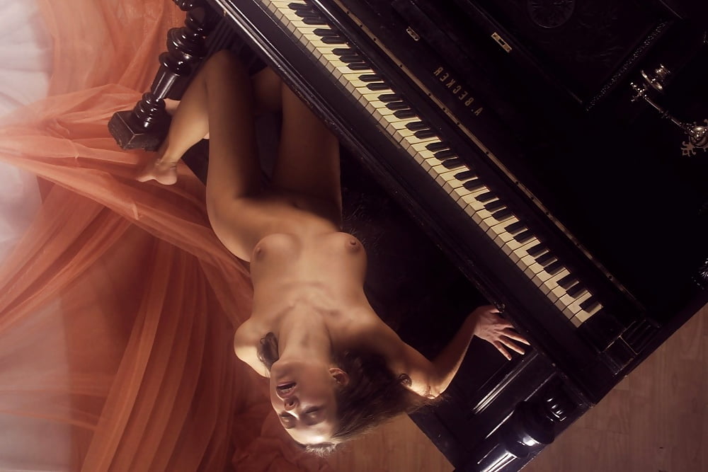 Half Naked Woman Plays The Piano Masterfully