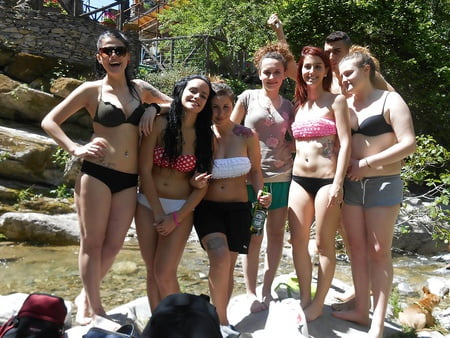 Hot young brunette in bikini with her friends