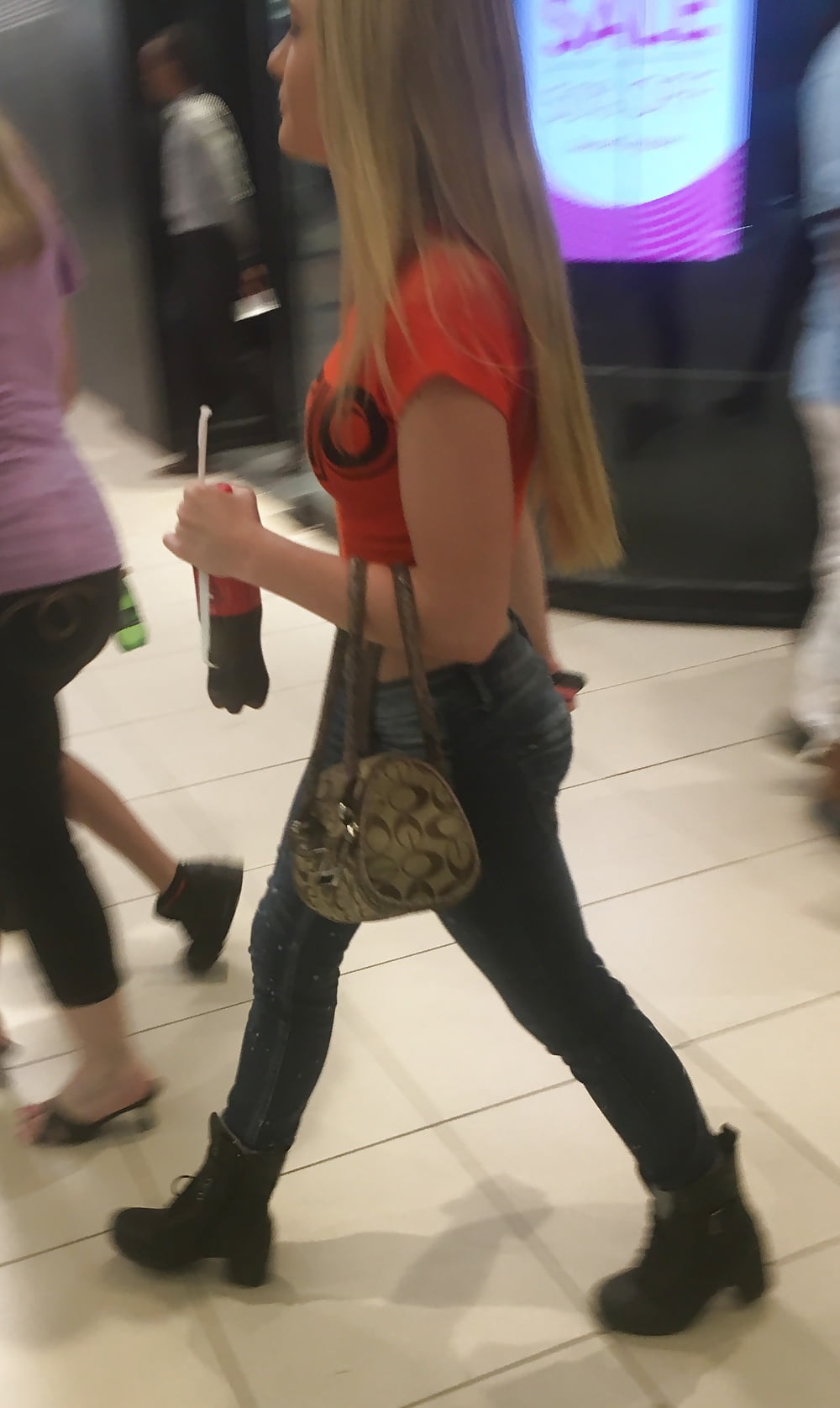 Pretty blonde mall teen and a MILF with legs porn pictures