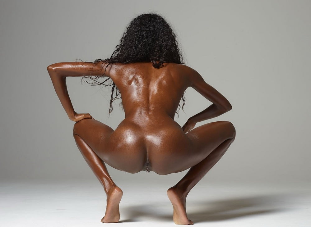 Nude black woman on the couch