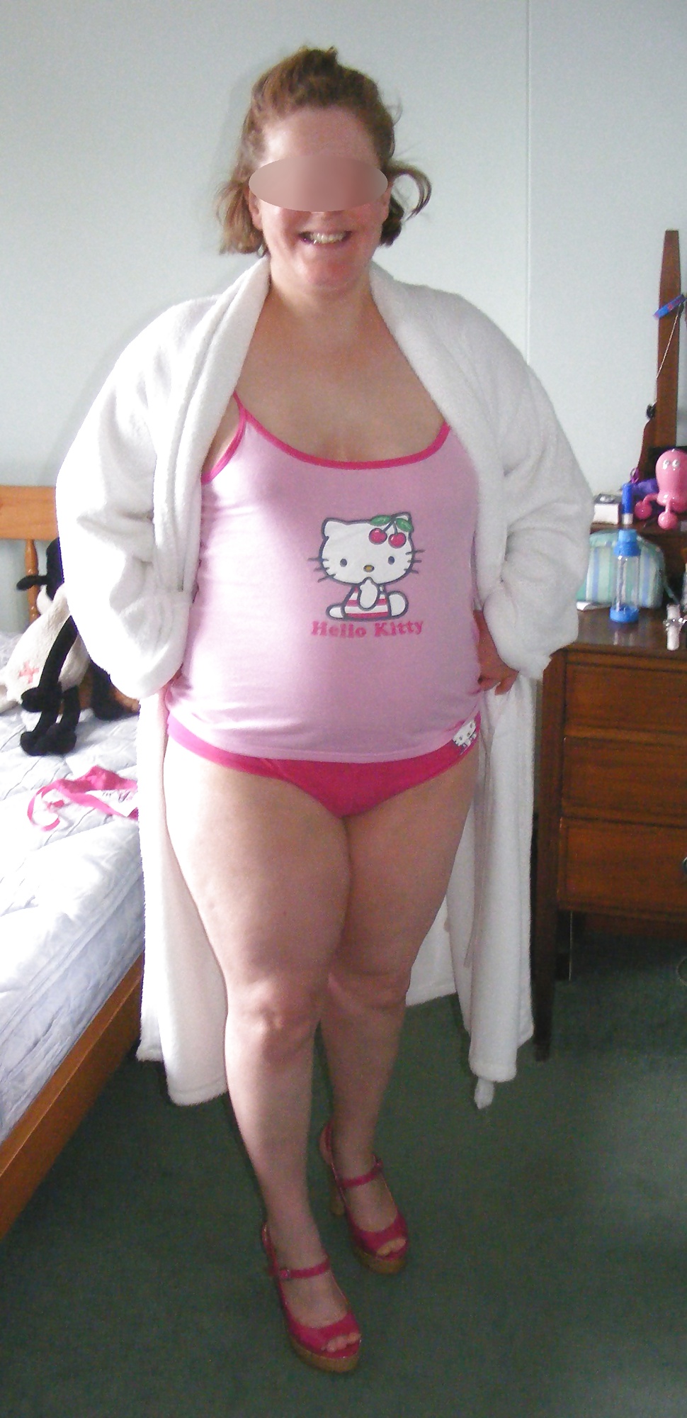 Slut in pink heels, in and out of Hello Kitty pyjamas porn pictures