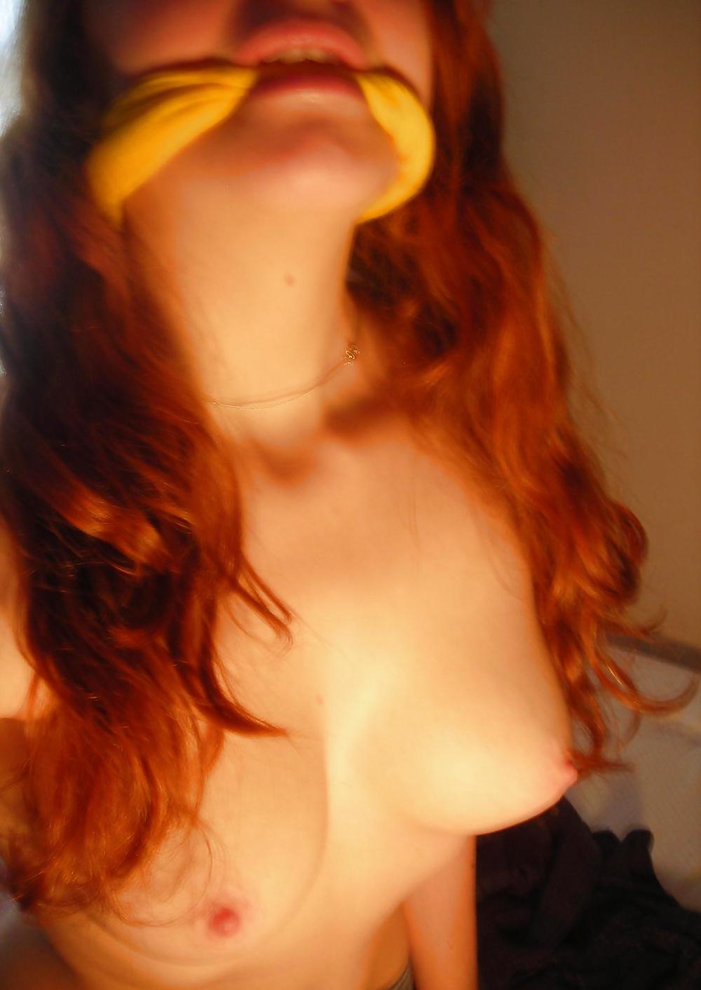 Sexy Red Head shows it all porn pictures