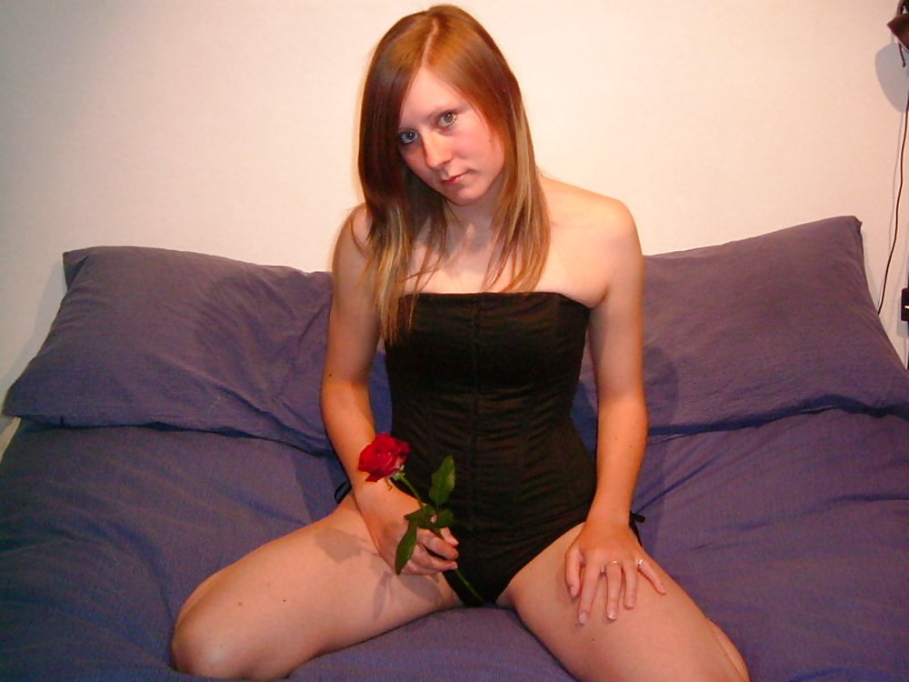 Redhead with perky tits and a rose - N. C. porn pictures
