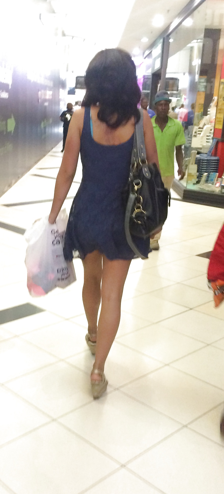 A mall milf with wonderful legs porn pictures