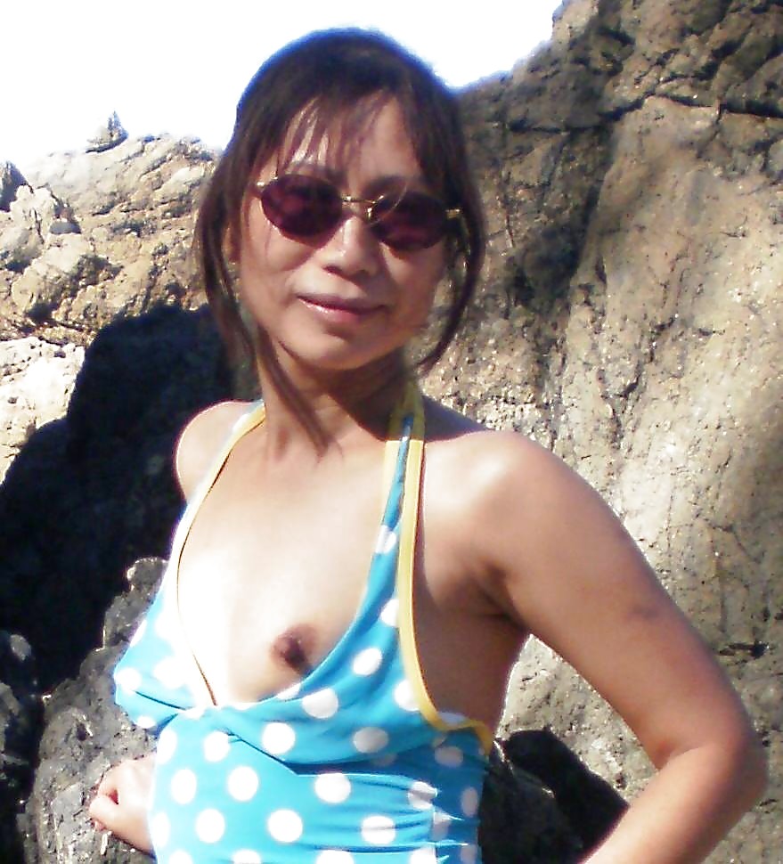 Very horny Asian milf, beach vacation porn pictures