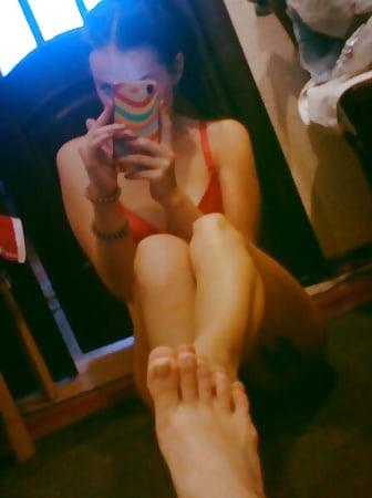 sexy girl in red doing selfie