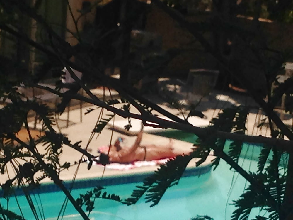 My neighbor Elle sunbathing topless in thong porn pictures