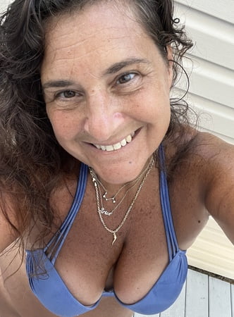 sunning in sexy purple bikini         